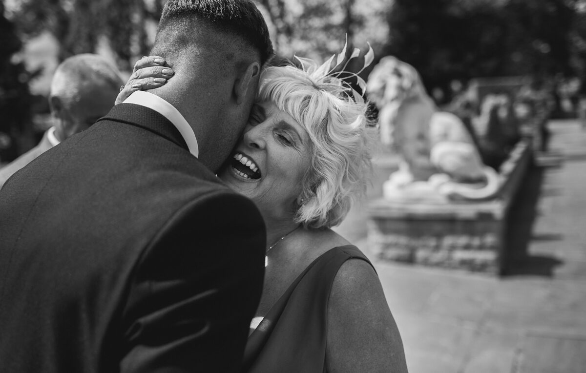 mum hugging groom